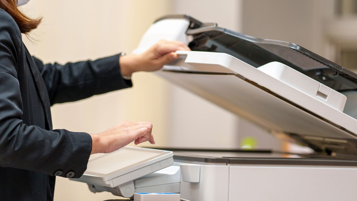 Female office workers making copies on a leased copier